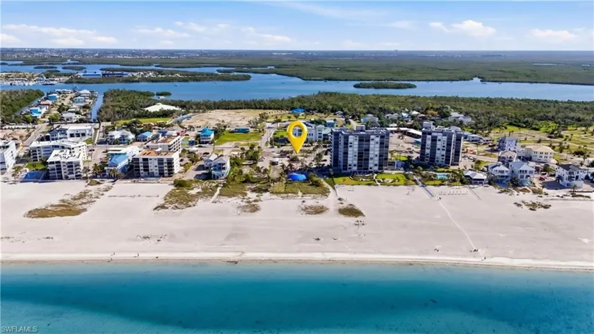 Coastal property featuring direct beach access and a beachfront location