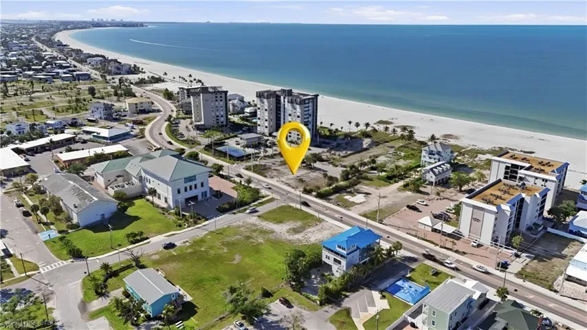 Expansive coastal area featuring a broad sandy beach and open water - Virtually Edited Image
