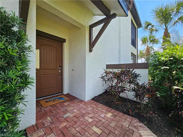 Property entrance featuring stucco siding