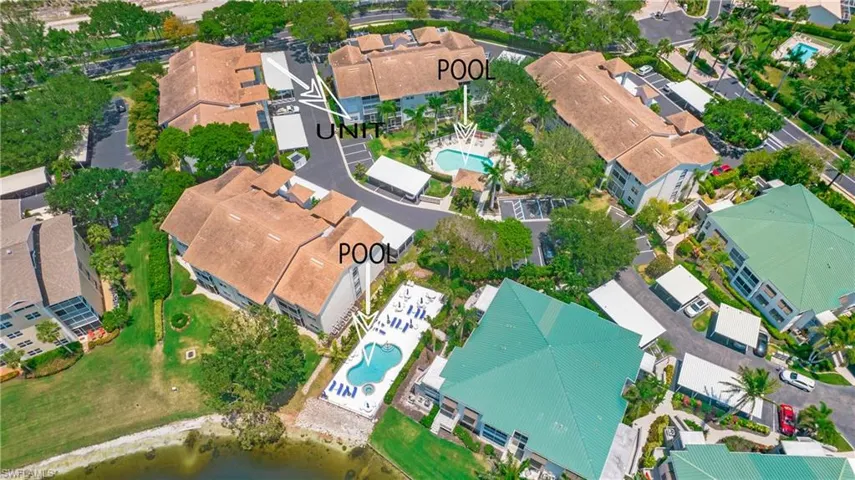 View of property location featuring a pool area and nearby suburban area