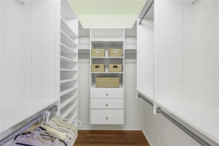 Spacious closet featuring wood-type flooring