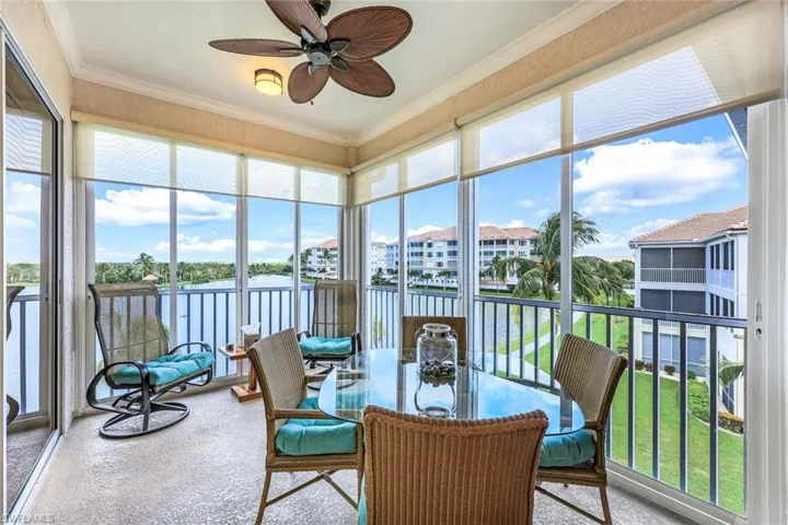 Sunroom / solarium featuring ceiling fan and a healthy amount of sunlight