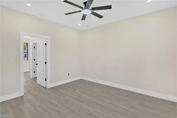Empty room with light wood-style floors, recessed lighting, and a ceiling fan