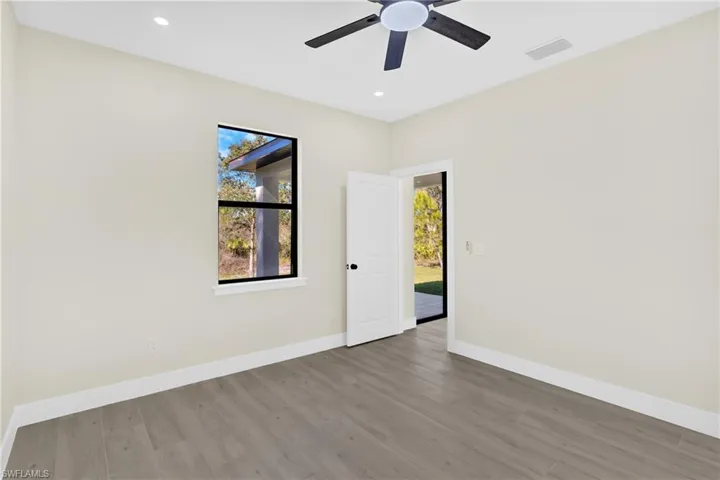 Unfurnished room featuring wood finished floors, recessed lighting, and ceiling fan