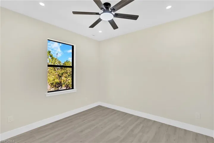 Empty room with light wood finished floors, recessed lighting, and ceiling fan