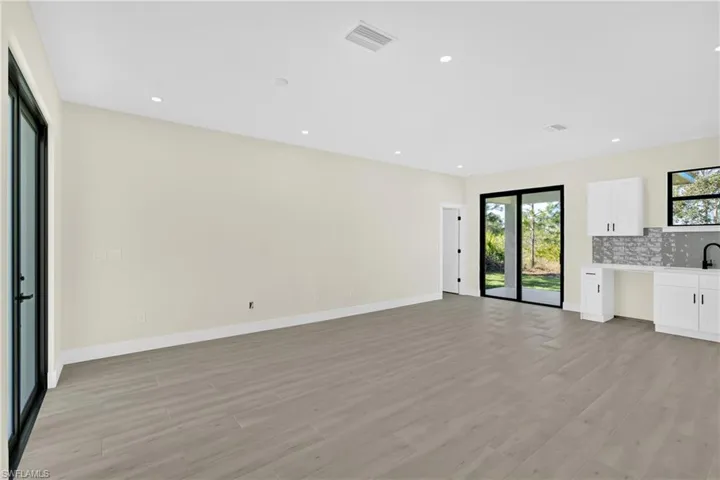 Unfurnished living room featuring recessed lighting and light wood-style floors