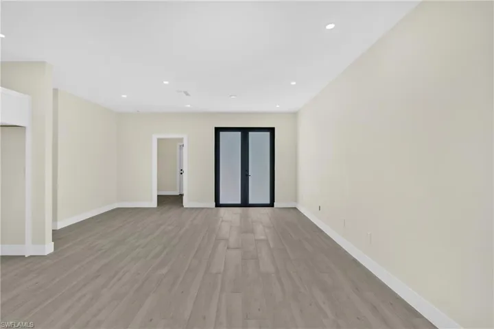 Spare room featuring light wood-style floors and recessed lighting