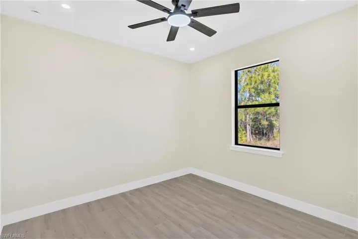 Unfurnished room featuring light wood-style flooring, recessed lighting, and a ceiling fan