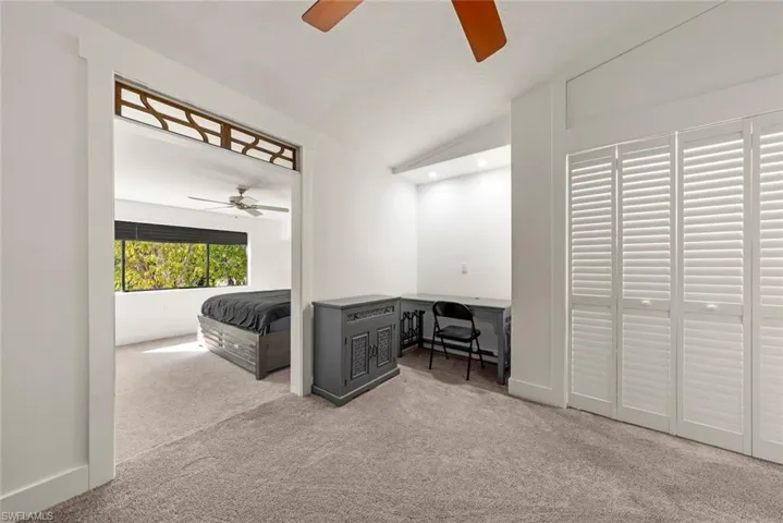 Sitting area second bedroom with ceiling fan, light colored carpet, lofted ceiling, and recessed lighting