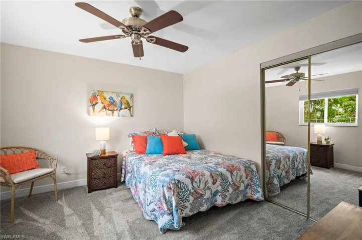 Bedroom featuring carpet floors, a closet, and ceiling fan