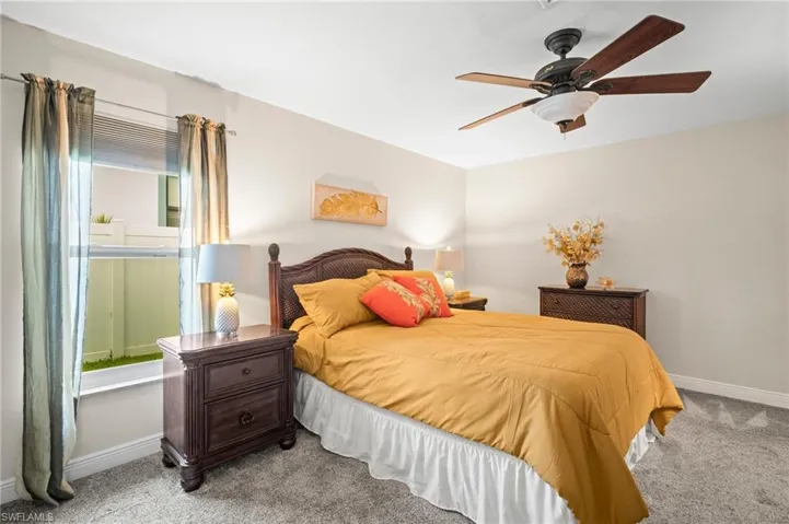 Bedroom with carpet and ceiling fan
