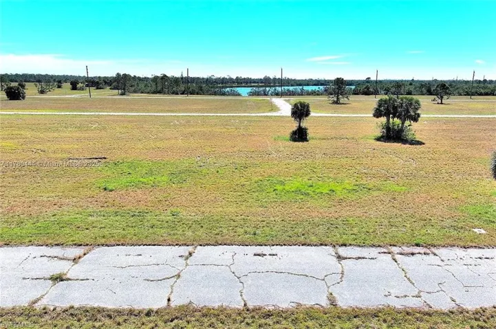 View of green lawn with a water view