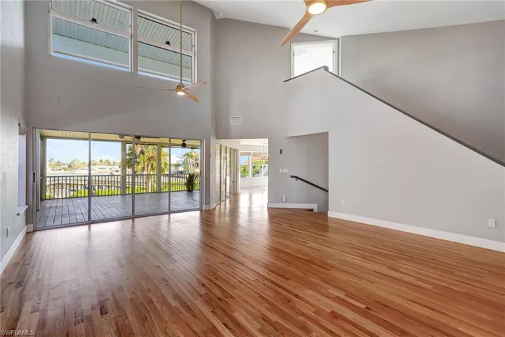 2 story Great room, featuring hardwood flooring