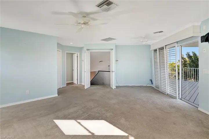 Primary Bedroom with access to outdoor balcony and deck