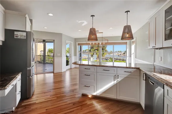 Kitchen, Light and bright, white cabinetry, and light hardwood floors