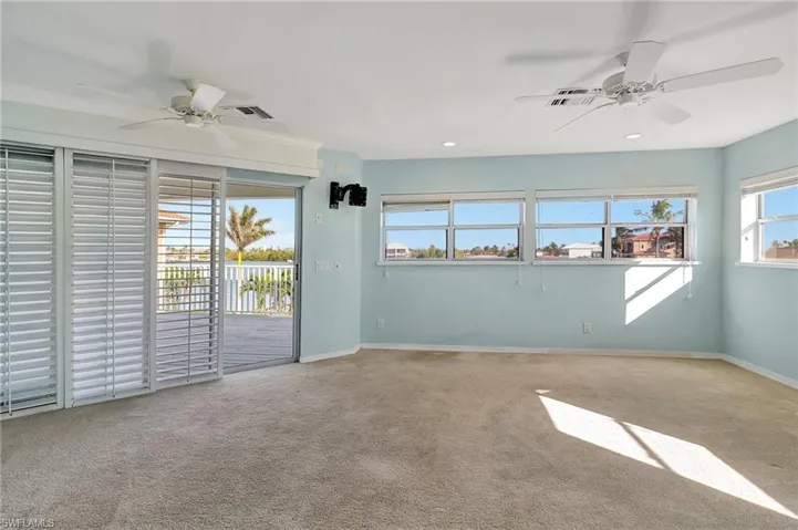 Primary Suite with access to spacious outdoor deck and balcony