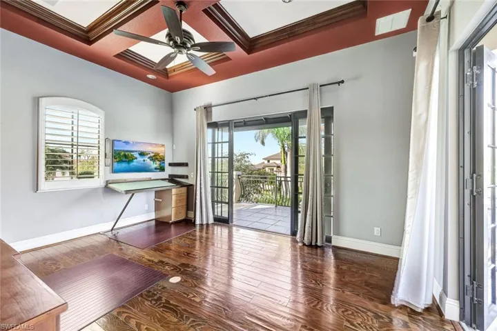 Entryway featuring a healthy amount of sunlight, coffered ceiling, and beamed ceiling