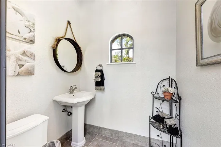 Bathroom featuring toilet and tile patterned floors