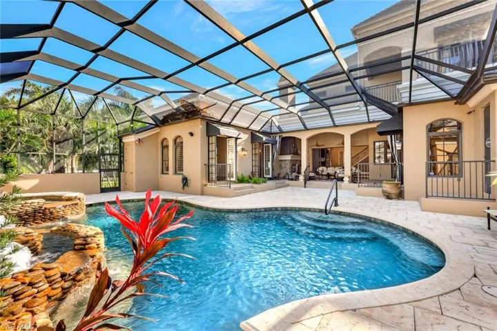 View of swimming pool with a lanai and a patio