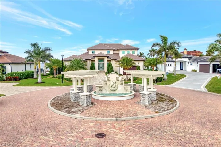 View of front facade featuring a pergola and a garage