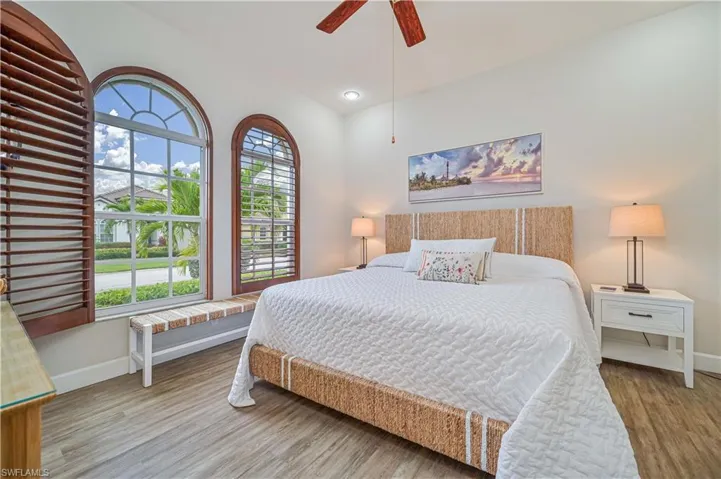 Bedroom with ceiling fan and light wood finished floors