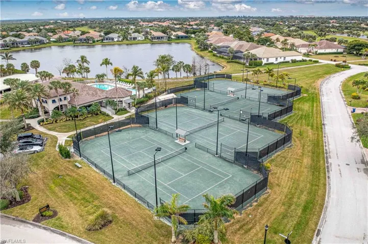 Aerial perspective of suburban area featuring a large body of water