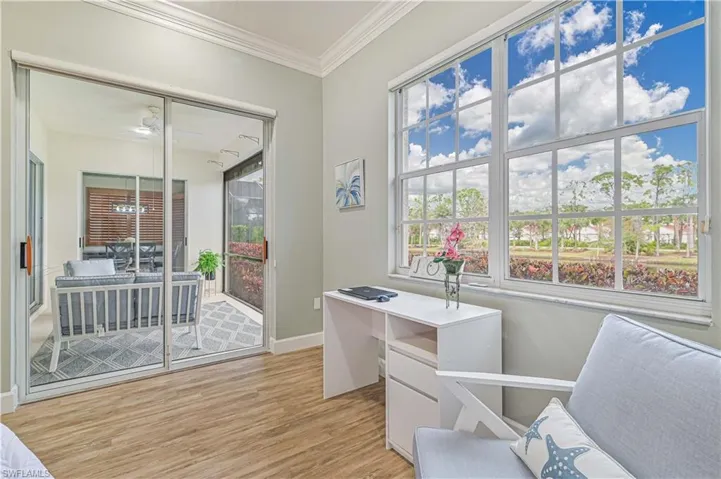 Office featuring light wood-style floors and ornamental molding