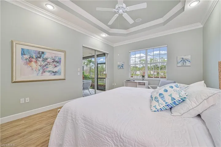 Bedroom with access to exterior, light wood-style floors, ceiling fan, crown molding, and recessed lighting