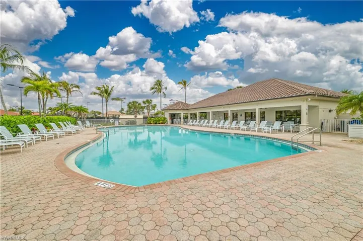 Community pool with a patio