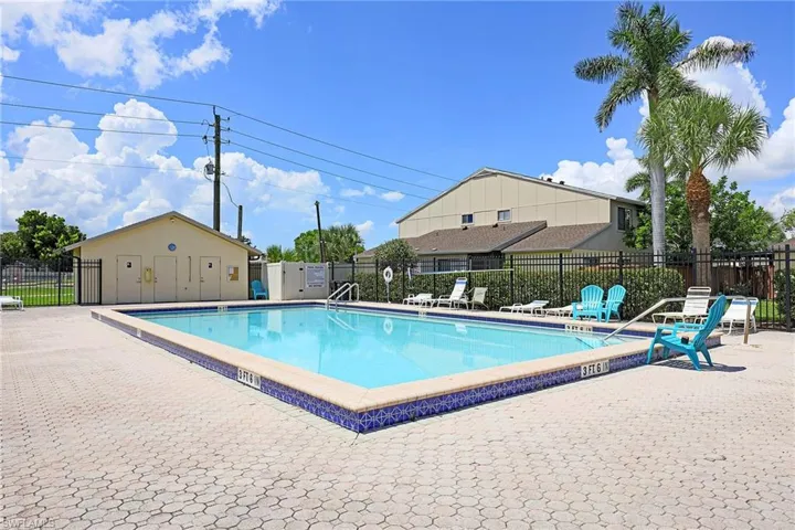 Community pool featuring a patio