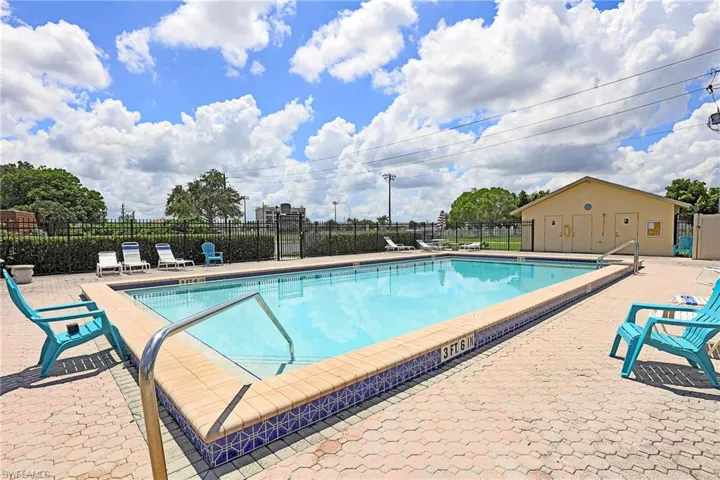 Community pool with a patio