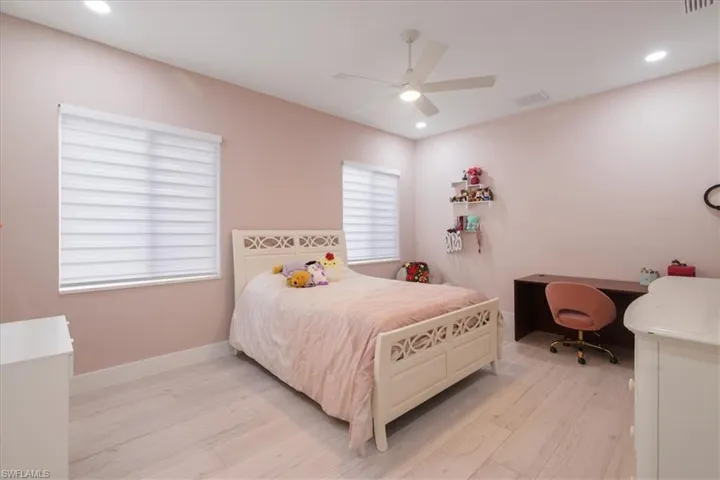 Bedroom featuring recessed lighting, light wood finished floors, and a ceiling fan