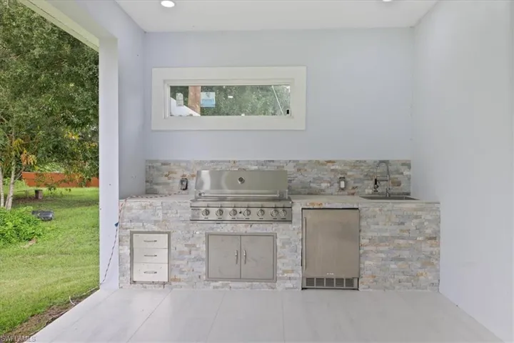 View of patio / terrace featuring area for grilling and a sink