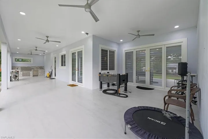 Workout area with recessed lighting and tile patterned flooring