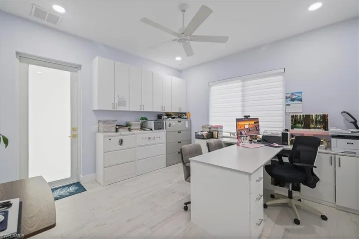 Office area featuring recessed lighting, light wood-type flooring, and a ceiling fan
