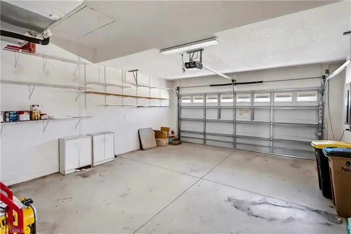 Garage featuring a garage door opener