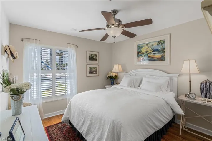 Bedroom featuring light wood-style flooring and a ceiling fan