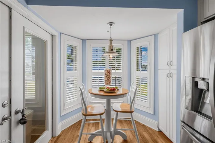 Dining space featuring light wood finished floors and baseboards