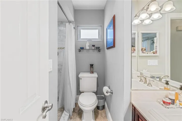 Bathroom featuring vanity and a shower with shower curtain