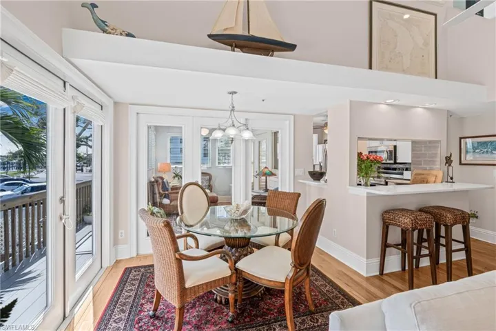 Dining area featuring light wood-style flooring and a chandelier