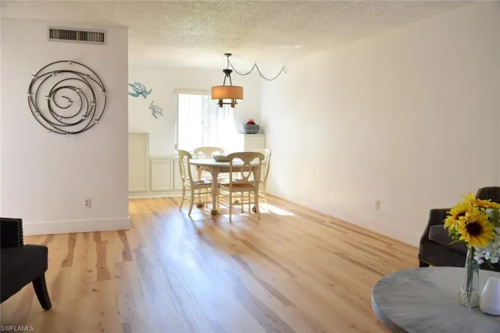 Expansive living area with wood-finish flooring