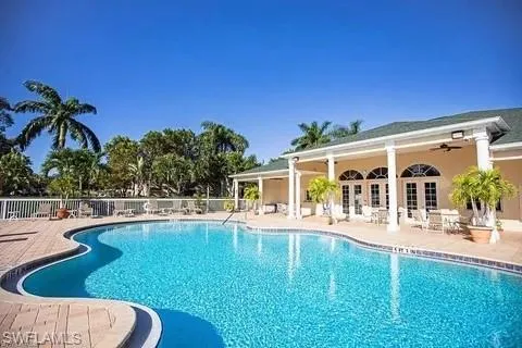 Community pool featuring a patio and french doors