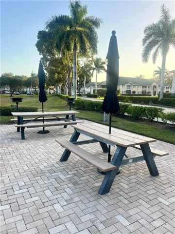 View of community with a lawn, a residential view, and a patio