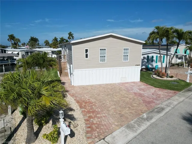 View of side of property featuring stairway