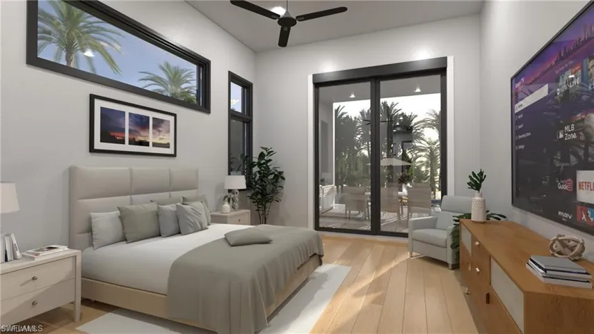 Bedroom featuring light wood finished floors, access to exterior, and a ceiling fan