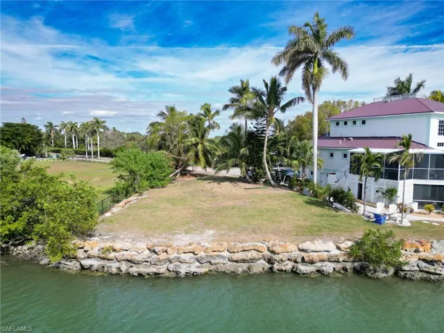 View of yard with a water view
