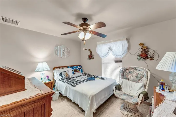 Bedroom featuring ceiling fan and light tile patterned flooring