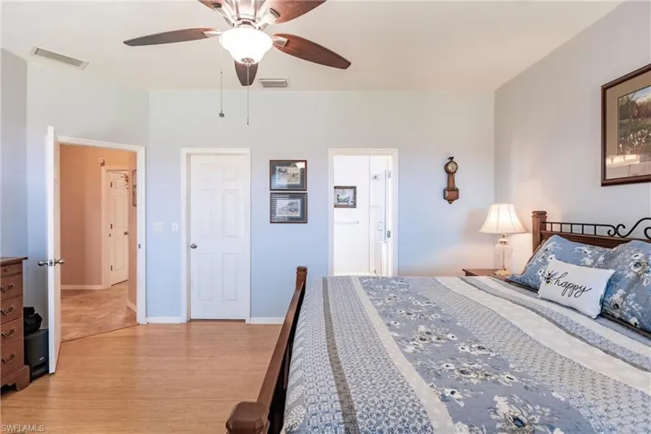 Bedroom featuring light hardwood / wood-style floors and ceiling fan