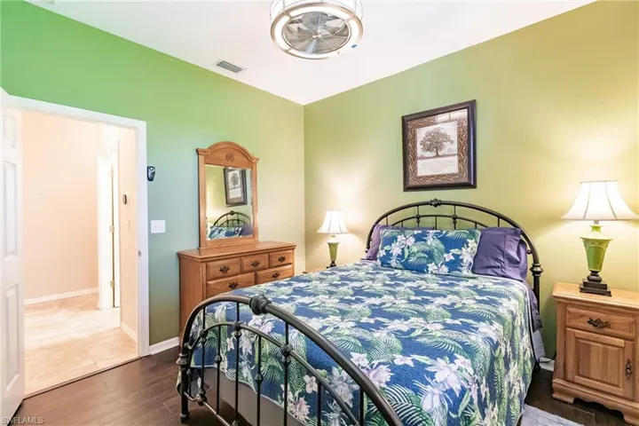 Bedroom with hardwood / wood-style flooring