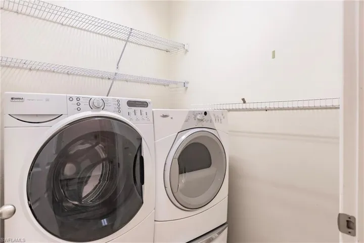 Laundry room featuring separate washer and dryer